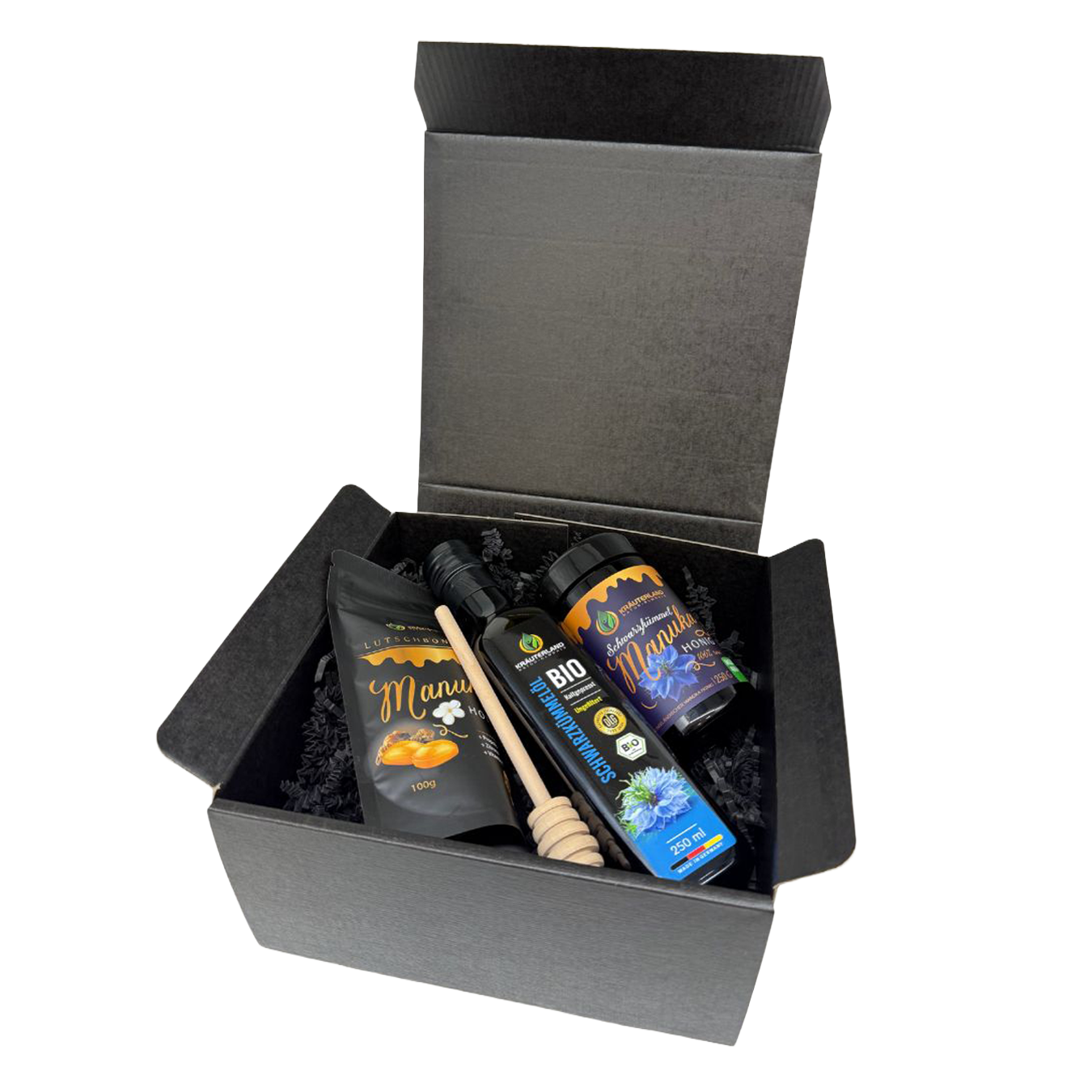 Geschenkset von Kräuterland mit Schwarzkümmel-Manuka Honig MGO 400 Schwarzkümmelöl und Manuka Lutschbonbons in schwarzer Geschenkbox