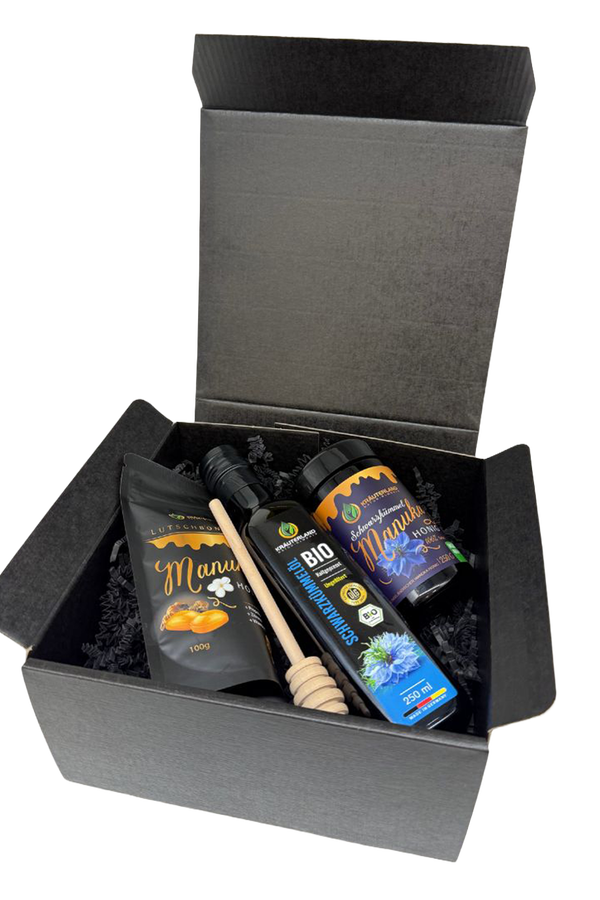 Geschenkset von Kräuterland mit Schwarzkümmel-Manuka Honig MGO 400 Schwarzkümmelöl und Manuka Lutschbonbons in schwarzer Geschenkbox